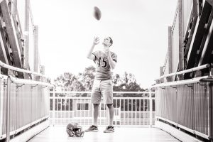Man tossing a football in the air